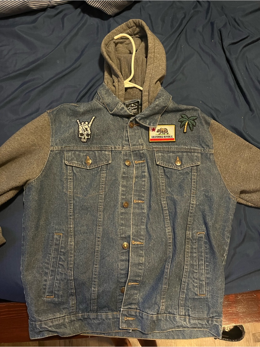 Denim Trucker Jacket with Gray Hoodie and Patch Details